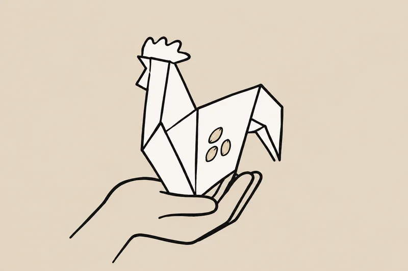 A paper rooster rests in a hand, with a folded section revealing seeds inside the paper.
